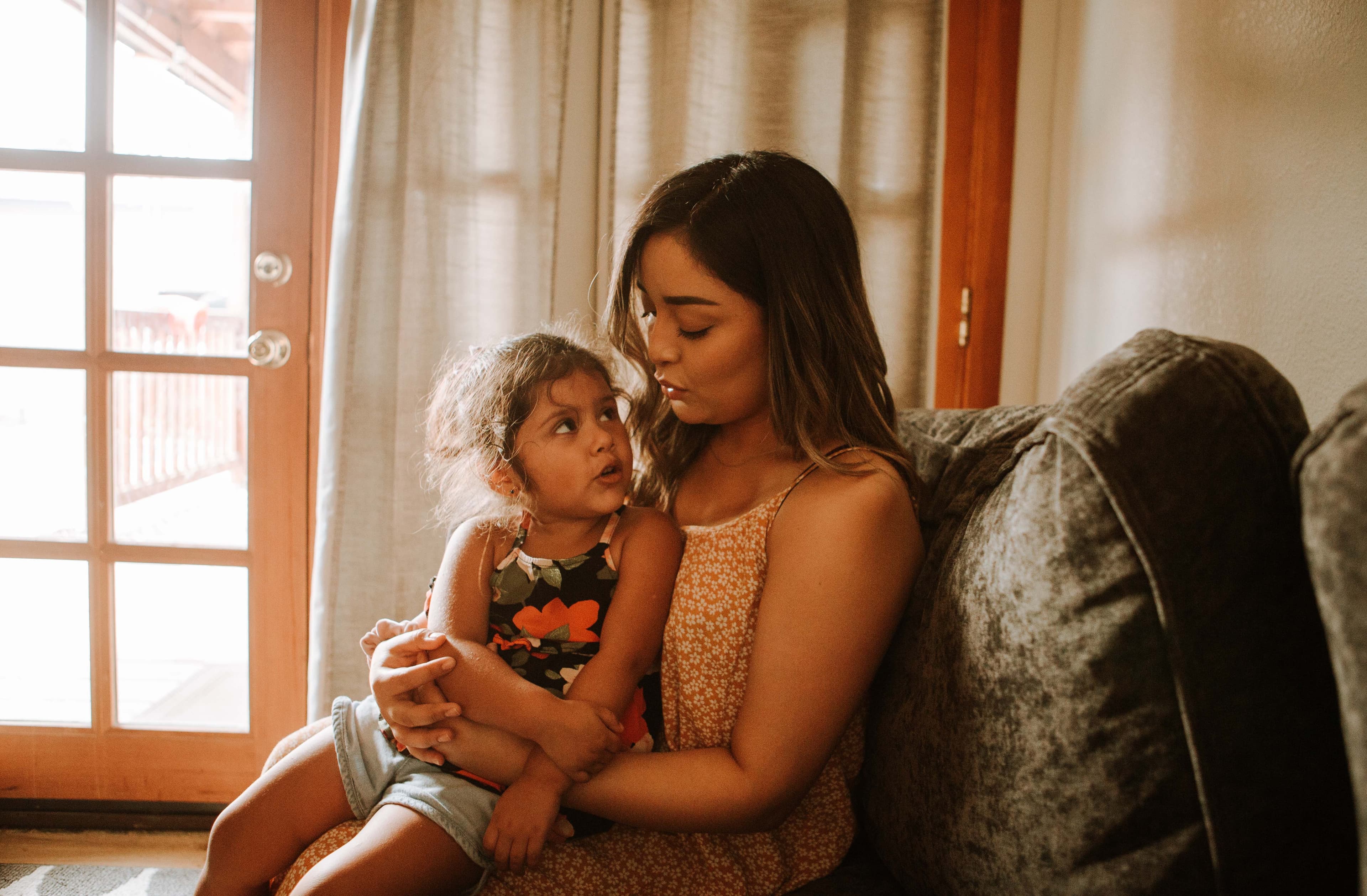 Mother holding daughter